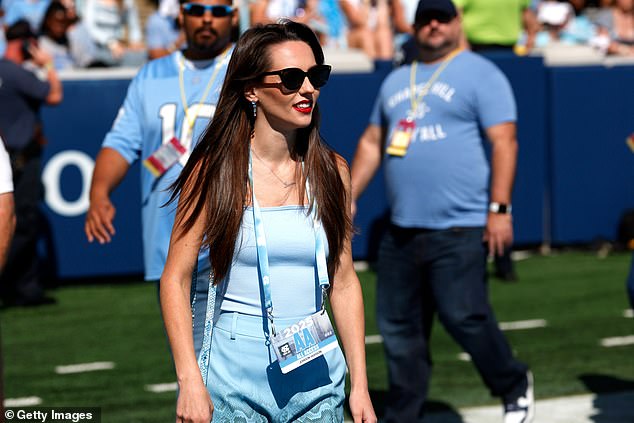 Jordon Hudson draws attention on the sidelines as Bill Belichick watches his North Carolina Tar Heels lose another painful game to California