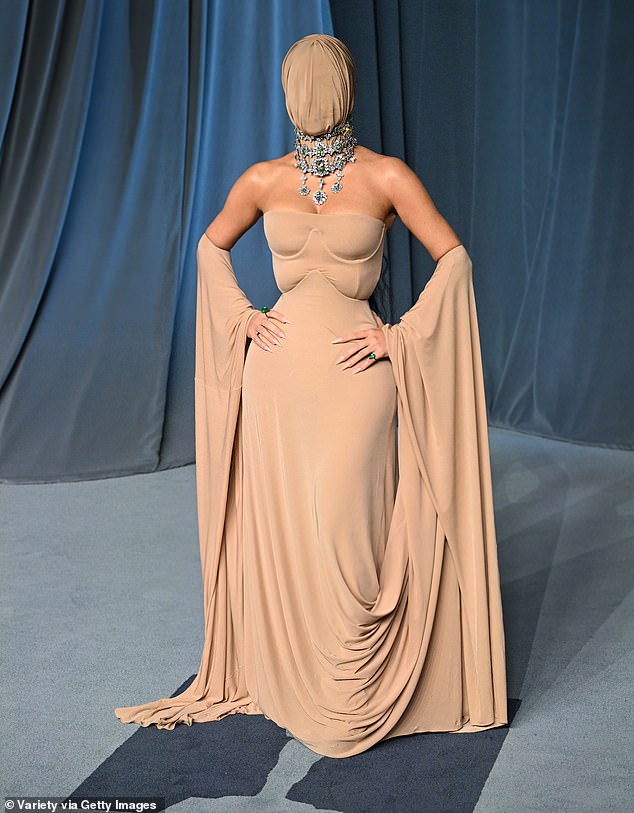 Kim Kardashian stuns fans with full-face mask and nude gown at star-studded Academy Museum Gala in Los Angeles