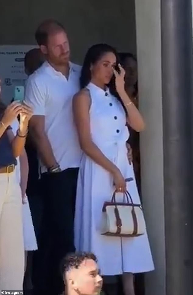 Meghan Markle shares warm hug and sheds tears at Los Angeles tennis fundraiser in support of her friend whose son tragically died of a viral illness