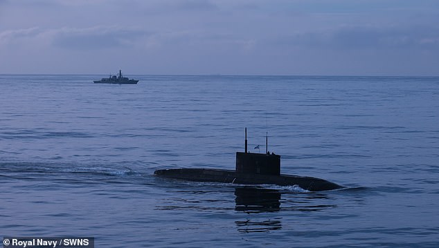Russian attack submarine forced to surface off the coast of Brittany and limp home under British escort after serious fuel leak in the Mediterranean