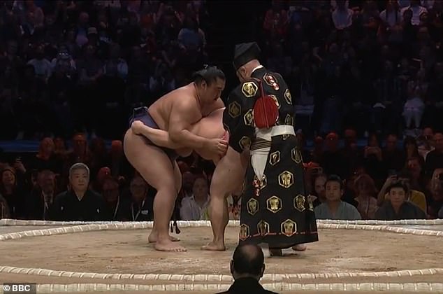 Sumo referee prevents embarrassing wardrobe mishap as Ura Kazuki’s belt comes loose during tense Grand Sumo Tournament bout in London’s Royal Albert Hall