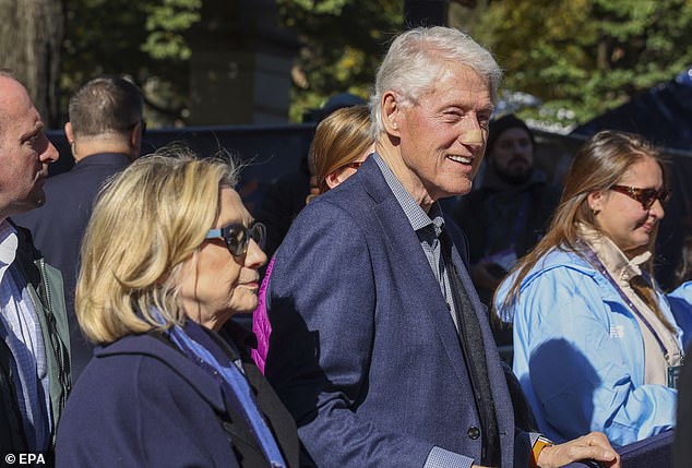 Bill Clinton appears with bandage on face while supporting daughter Chelsea at New York City Marathon
